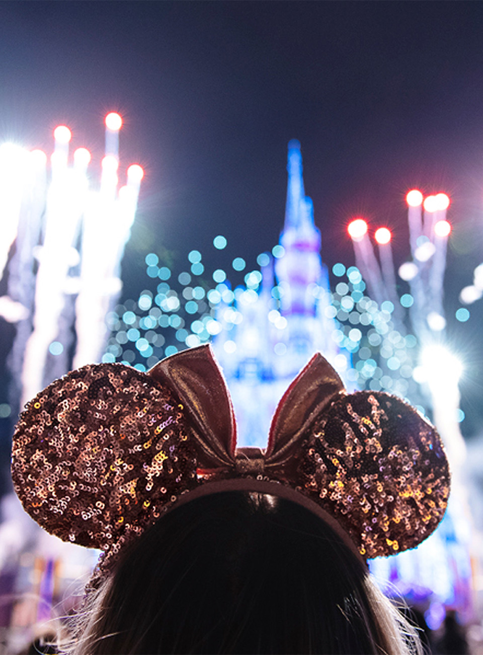 Minnie Mouse ears and Disneyland fireworks